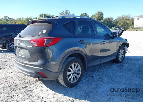 2014 Mazda Cx-5 Touring z USA, uszkodzony, nr VIN JM3KE2CY1E0339579